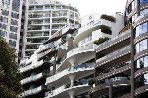 Modern apartment buildings with curved glass balconies in an urban residential development